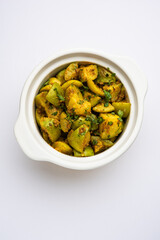 Indian style Tinda or Tinde ki Sabzi also called Indian squash, round melon, Indian round gourd or Indian baby pumpkin, stuffed, stir fried dry or curry recipe