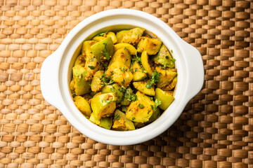 Indian style Tinda or Tinde ki Sabzi also called Indian squash, round melon, Indian round gourd or Indian baby pumpkin, stuffed, stir fried dry or curry recipe