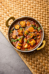 Stir fried taro roots. Arbi ki sabji, ghuiya masala curry Sabzi or arvi dum Masala. Garnished with coriander