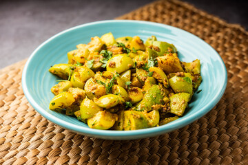 Indian style Tinda or Tinde ki Sabzi also called Indian squash, round melon, Indian round gourd or Indian baby pumpkin, stuffed, stir fried dry or curry recipe