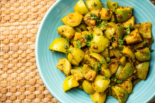 Indian style Tinda or Tinde ki Sabzi also called Indian squash, round melon, Indian round gourd or Indian baby pumpkin, stuffed, stir fried dry or curry recipe