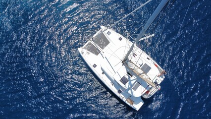 Top view at twisting catamaran anchored on Adriatic sea