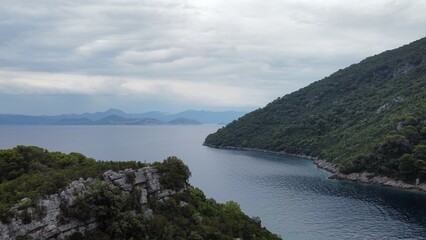 Fototapeta na wymiar Adriatic sea flow between green hills