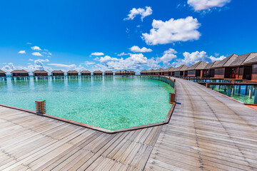 Maldives paradise background. Tropical aerial landscape, seascape with long pier, water villas, amazing sea sky and lagoon beach, tropical nature. Exotic tourism destination banner, summer vacation