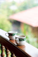 cup of coffee in the cafe. two cups of coffee on the terrace front table