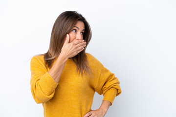 Middle age caucasian woman isolated on white background doing surprise gesture while looking to the...