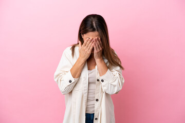 Middle age caucasian woman isolated on pink background with tired and sick expression