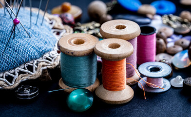 Colorful retro threads on wooden bobbins