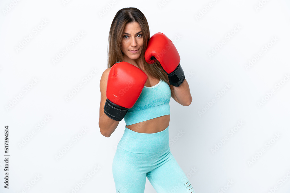 Wall mural middle age caucasian woman isolated on white background with boxing gloves