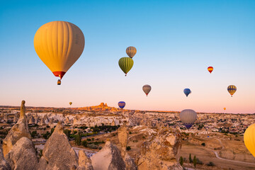 Hot air balloons making bright sky in Cappadocia, Turkey - obrazy, fototapety, plakaty