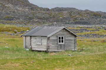Fototapeta premium The view of old wooden fishermen's house at Hemmendorf at Varanger Penisula in Norway.