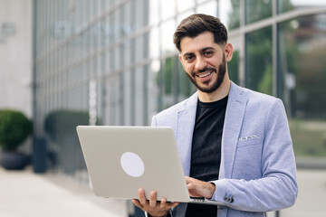 Handsome bearded businessman professional financial advisor, executive leader, manager, male lawyer or man entrepreneur standing in office posing for headshot business portrait