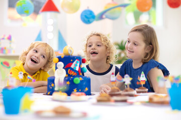 Fototapeta premium Kids space theme birthday party with cake.