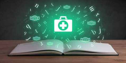 Open medical book with health icons above