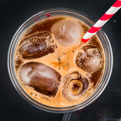 iced layered coffee drinks with orange juice top view, flat lay