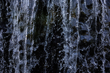 Waterfall with flowing water closeup