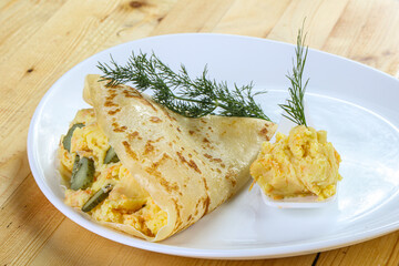Pancake with. potato and pickled cucumbers