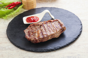 Grilled rib-eye steak beef meat