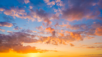 Fototapeta na wymiar Sky with clouds during sunset. Clouds and blue sky. Panoramic photo for design and background.