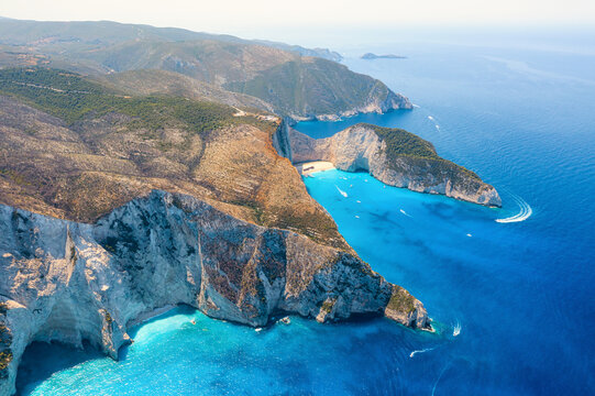 View of Navagio beach, Zakynthos Island, Greece. Aerial landscape. Azure sea water. Rocks and sea. Summer landscape from the air.