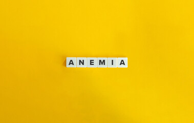 Anemia or Anaemia Word on Block Letter Tiles on Yellow Background. Minimal Aesthetics.