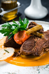 costolette on red wine, beef ribs in Italian