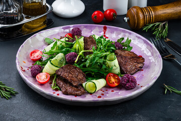 Italian Beef Tagliata salad with cherry tomatoes and parmesan cheese, beef sous vide