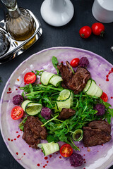 Italian Beef Tagliata salad with cherry tomatoes and parmesan cheese, beef sous vide