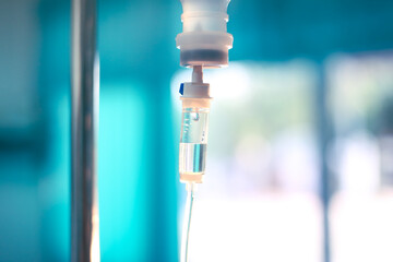 Set iv fluid intravenous drop saline drip hospital room,Medical Concept,treatment emergency and injection drug infusion care chemotherapy, concept.blue light background,selective focus