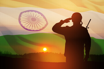Silhouette of soldier saluting on a background of India flag and the sunset or the sunrise. Greeting card for Independence day, Republic Day. India celebration.