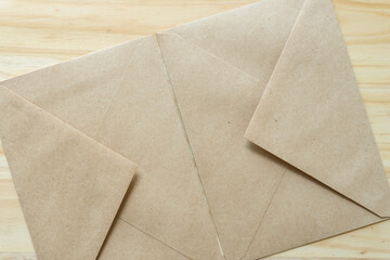 two brown paper envelopes touching