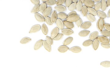 Heap of pumpkin seeds isolated on white background