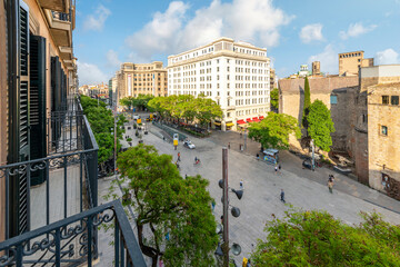 From from a balcony terrace of the skyline and Plaça Nova square of Barcino alongside the Barcelona Cathedral near the Gothic Quarter of Barcelona, Spain.