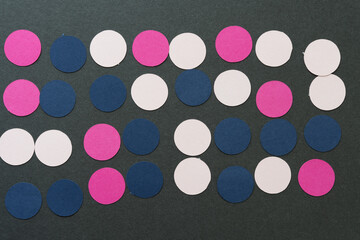 background with paper circle motifs - pink, blue, magenta circles on gray paper