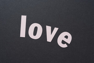 love in pink letters on gray background