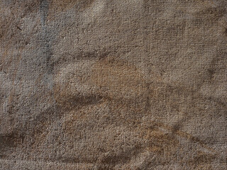 Fototapeta na wymiar wrinkled and painted burlap or hessian sacking as a background
