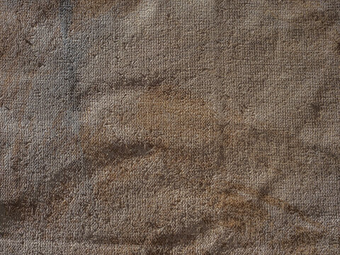 wrinkled and painted burlap or hessian sacking as a background