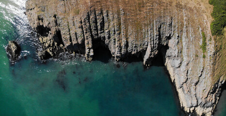 Cliff edge overlooking the sea coastline beach 