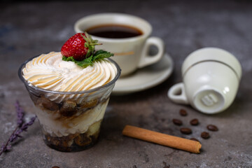tiramisu with strawberries with a cup of coffee