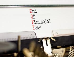 EOFY end of financial year symbol. Concept words EOFY end of financial year typed on beautiful old retro typewriter. Black metallic pen. Business and EOFY end of financial year concept.