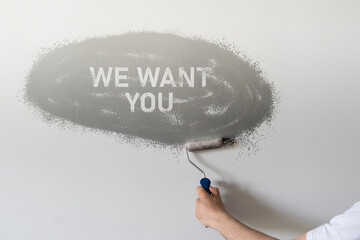 we want you text on the wall, creative hiring banner