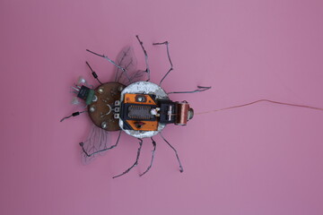 a robot spider attacks a robot fly