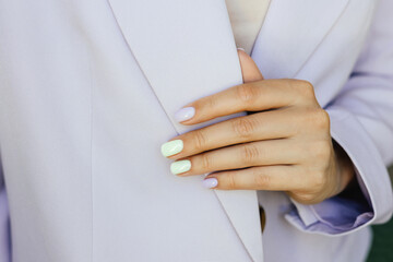 Beautiful purple manicure on a purple background