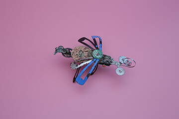 a robo dragonfly built from scrap metal
