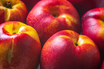 Ripe nectarines fruit background closeup