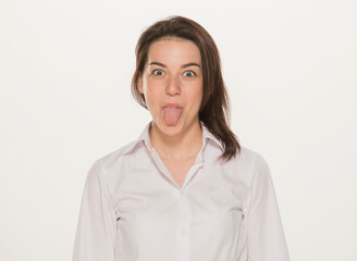 portrait of a girl in a white shirt isolated.close-up portrait of a young girl in a white shirt on a white background isolated.emotions joy happiness surprise calmness chagrin.win lose.