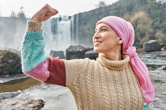 latina woman with cancer with arms showing strength