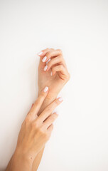 woman applying cream on their hands