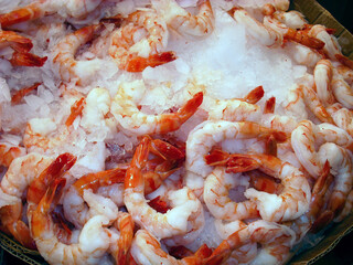 Prawns on ice at a seafood market.