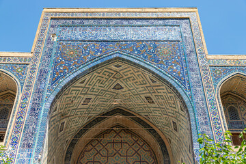 SAMARKAND, UZBEKISTAN - JUNE 09, 2022: Sher Dor Madrasa (Ulugh Bek) is a part of Registan ancient city.